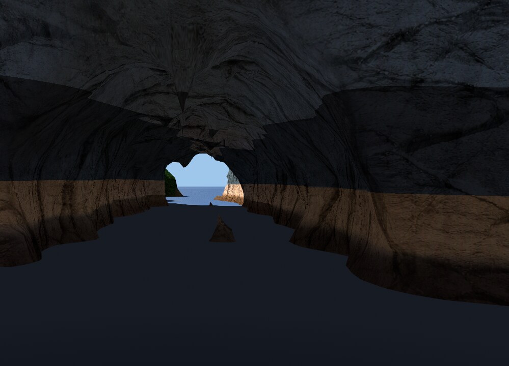 Inside a sea cavern looking out through the arch